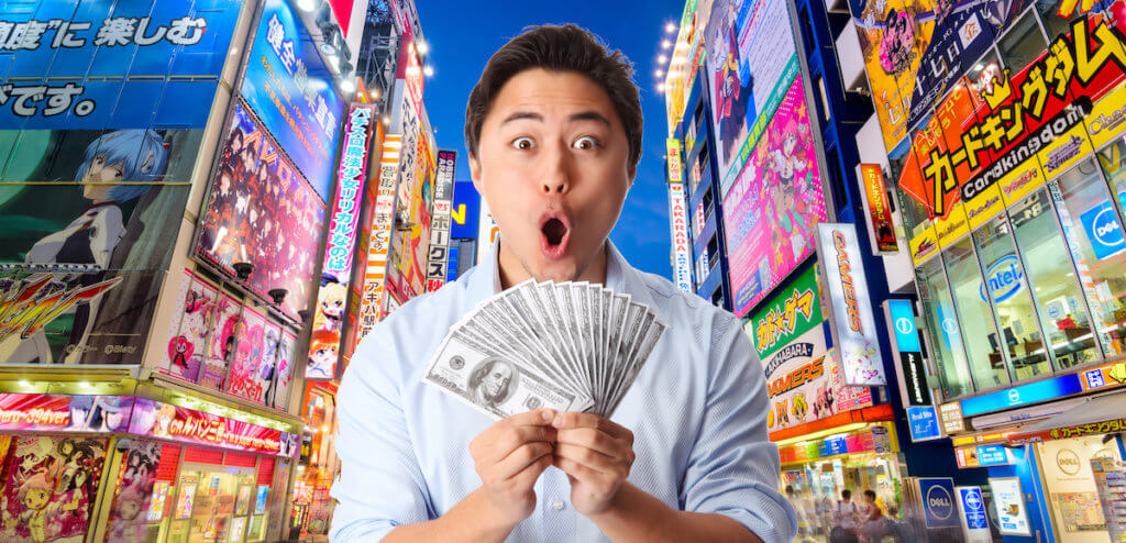 Akihabara Tokyo Japan Man holding money in Tokyo